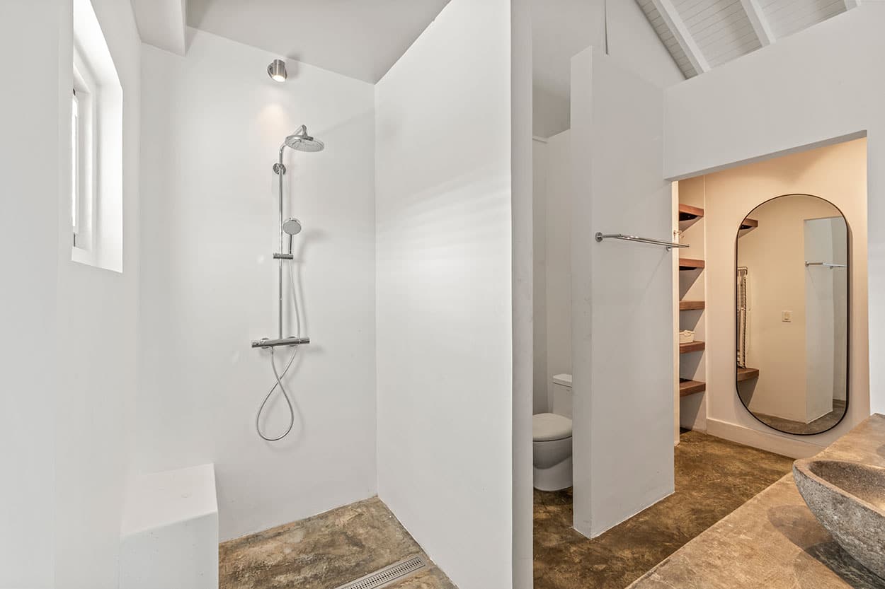 Bathroom with walk-in rain shower and double sinks