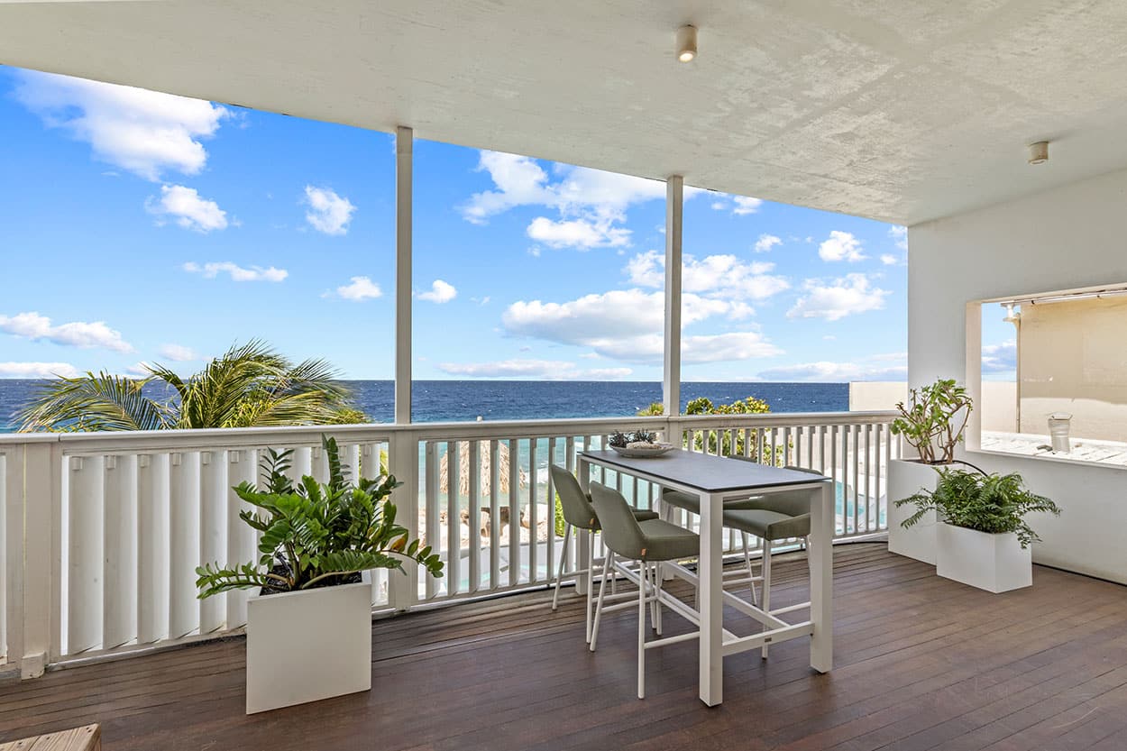 Balcony with lounge chairs and sea view
